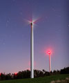 A wind turbine under the stars